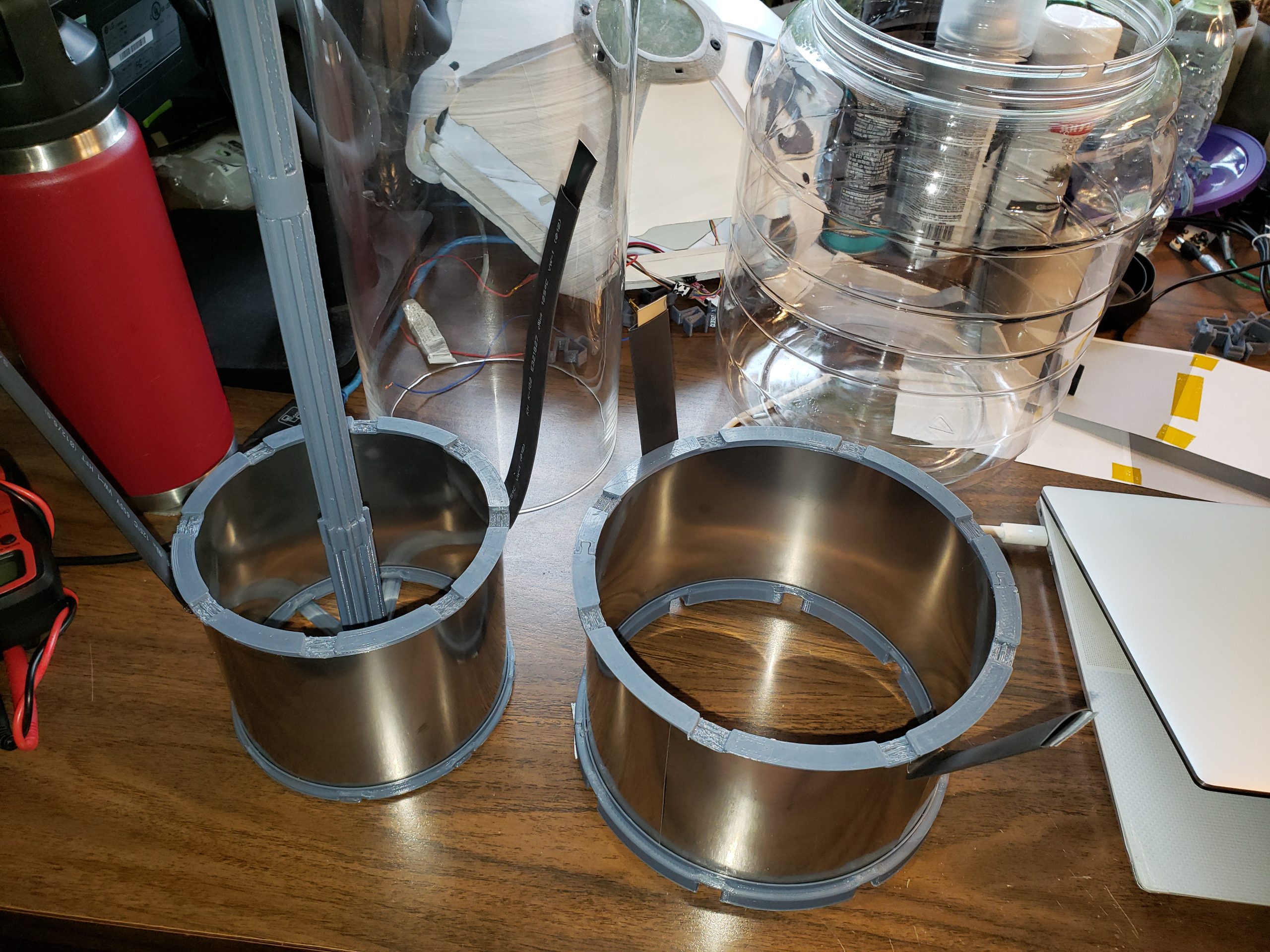 Smaller Cathode is inside the bell and the larger Annode is outside